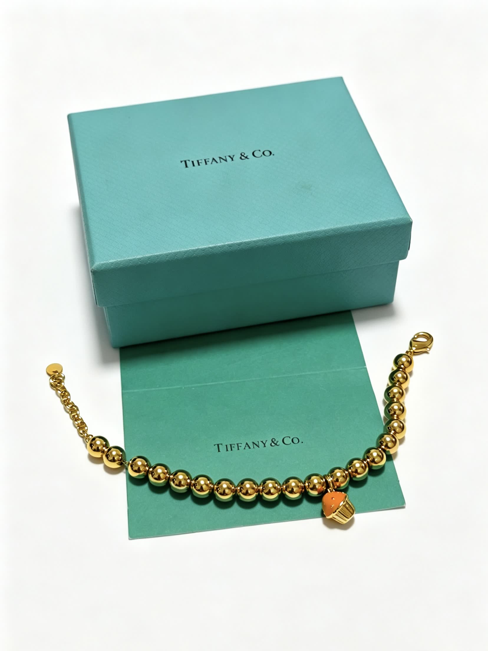 Tiffany & Co. Gold Bead Bracelet with Cupcake Charm
